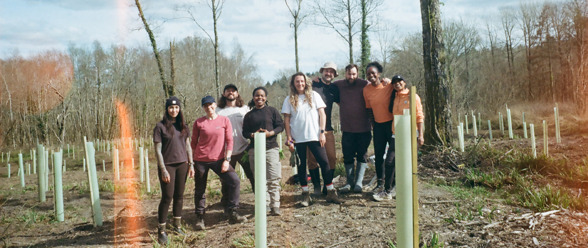 A group photo in a forest clearing