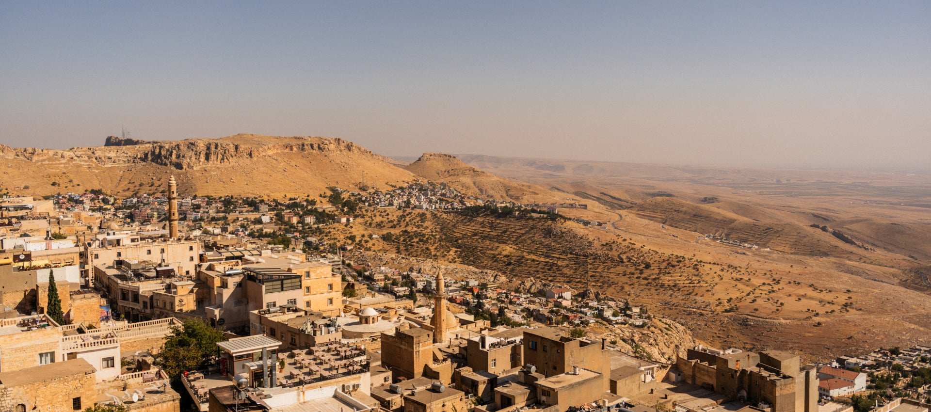 A landscape image of a city in a desert